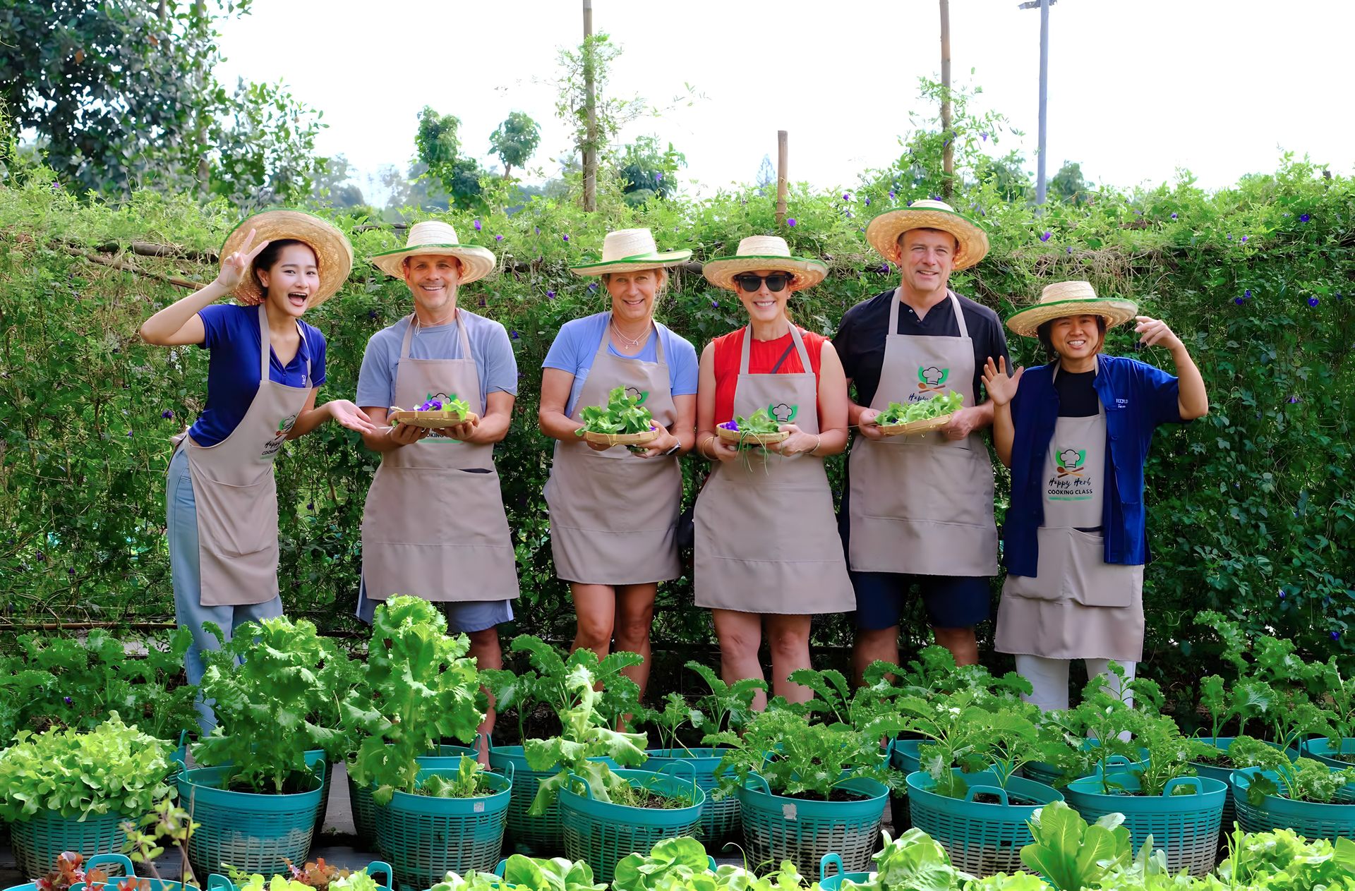 Group photo on the organic farm at Happy Herb Cooking Class in Chiang Mai